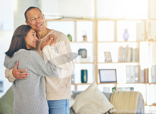 Image of Love, romance and married with a couple hugging while standing in their home together with mockup or flare. Affection, bonding and hug with a mature man and woman embracing in their domestic house