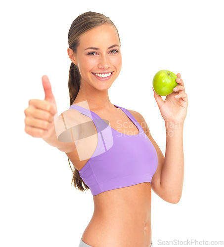 Image of Woman, apple and thumbs up in studio portrait for health, nutrition or wellness by white background. Isolated model, healthy fruit or smile for diet goal, vitamin c or natural detox for strong body