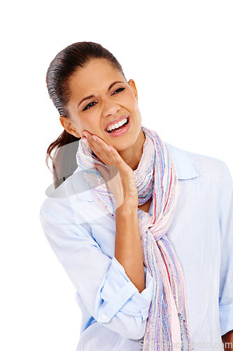 Image of Dental, toothache and oral hygiene with a black woman in studio isolated on a white background at the dentist. Teeth, gums and cavity with a female holding her jaw on blank space from tooth decay