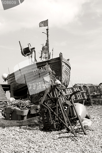 Image of traditional wood fishing boat with pirate flag