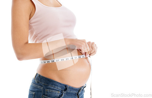 Image of Pregnant woman, measuring tape and stomach on a white background to check growth, development and health. Abdomen, wellness and pregnancy for self care, diet and healthy progress goals on mock up