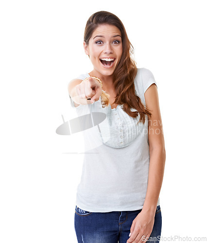 Image of Beautiful, happy and excited woman pointing finger with expression against a white studio background. Portrait of isolated female model posing with smile in happiness standing with hand gesture