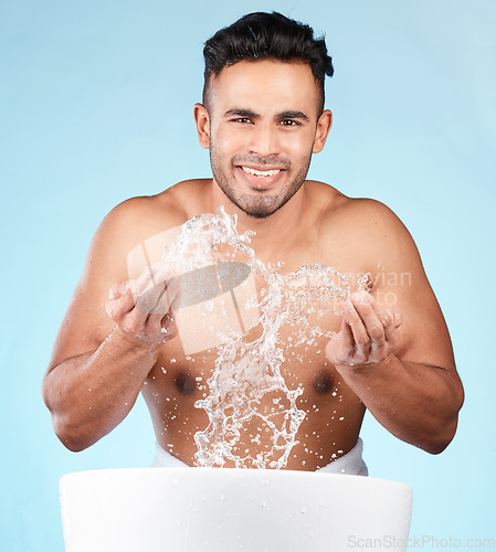 Image of Cleaning, water splash and portrait of man happy with self care routine, facial hygiene and body hygiene wash. Water drop, bathroom skincare hydration and beauty model with health wellness treatment