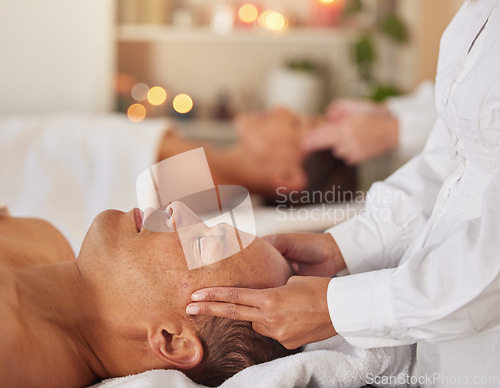 Image of Massage, reiki and couple at spa with therapist hand, chakra balance with wellness, spiritual and self care. Peace, zen and luxury service with masseuse, relax and mental health break holiday in Bali