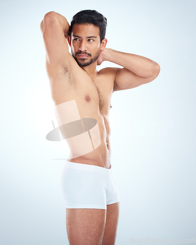 Image of Asian model, sports athlete and strong man flexing arms, stretching back and relax body vision. Man, fitness exercise wellness and body care workout motivation or goals mindset in studio background.