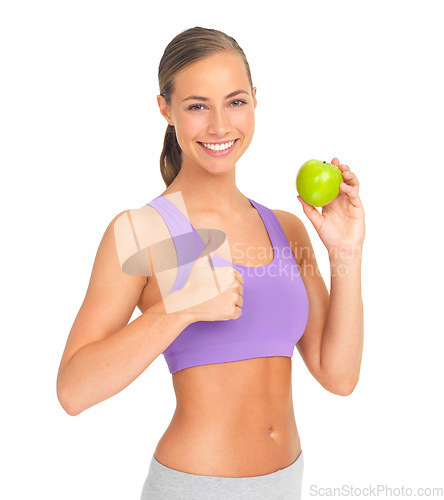 Image of Thumbs up, apple and fitness of woman in studio isolated on white background. Face, portrait and female model with hand gesture and fruit for healthy diet, wellness or nutrition, vitamins or minerals