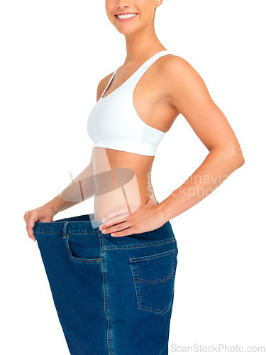 Image of Health, weight loss and woman with jeans and tummy tuck with skinny waist, cropped and isolated on white background. Fitness, healthcare and wellness, girl with slim figure after liposuction or diet.