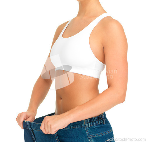 Image of Diet, weightloss and woman holding jeans with thin waist, cropped and isolated on white background. Fitness, health and wellness, girl with slim figure and weight loss after liposuction progress.