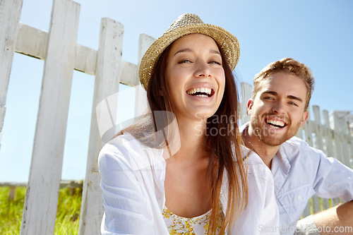 Image of Portrait, love and date with a couple in the park during summer vacation or holiday together in nature. Spring, garden and relax with a man and woman sitting in a field for dating or bonding
