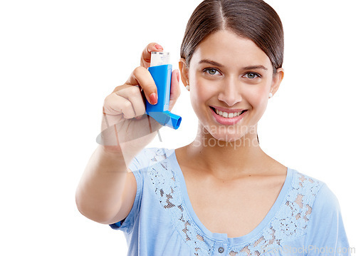 Image of Woman, asthma pump and smile for breathing, relief or respiratory against a white studio background. Portrait of isolated female holding inhaler for medical allergies, breathe or health solution