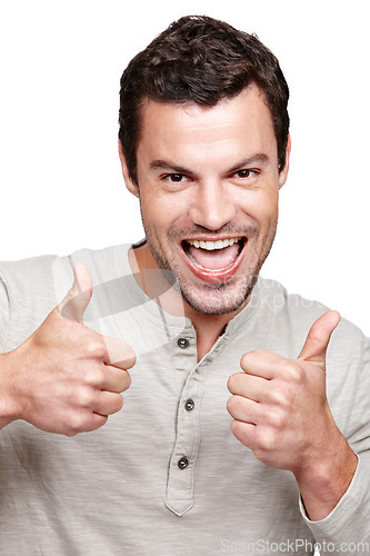 Image of Portrait, thumbs up and support with a man in studio isolated on a white background as a winner or for motivation. Thank you, goal and target with an excited man showing a positive hand sign or emoji