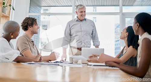 Image of Business, man and team with leader, meeting or brainstorming in office. Teamwork, male employee or ceo with staff, group project or share idea for collaboration, leadership or innovation in workplace