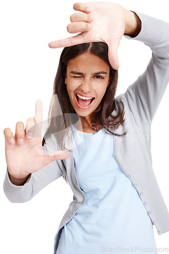 Image of Business woman, framing face and portrait of a person holding hands with a smile. White background, isolated and vertical frame of a female employee in a studio with mock up making a image hand sign