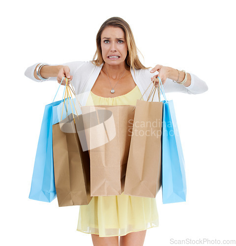 Image of Woman, shopping and oops with bags in studio portrait with expenses, surprise and white background. Model, shopping bags and isolated regret for fashion, sale and discount for spending shopaholic