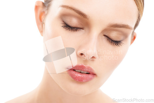 Image of Woman, face skincare or makeup cosmetics and lip gloss, eyeshadow or mascara in self care or dermatology wellness. Zoom, beauty model and facial product for healthy collagen glow on white background