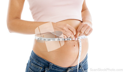 Image of Pregnancy, measuring tape and woman stomach in studio to check growth, development and health on mockup. Abdomen, wellness and pregnant woman self care, diet and healthy progress on white background