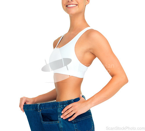 Image of Health, weight loss and diet, woman with jeans and tummy tuck with skinny waist, cropped and isolated on white background. Fitness, healthcare and wellness, girl with slim figure and shrinking pants.