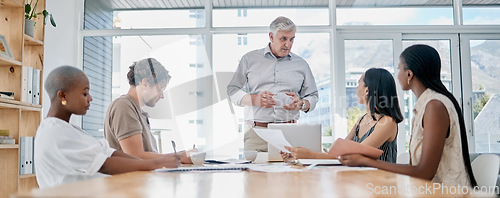 Image of Meeting, coaching and education with a business man manager and his team in the boardroom for planning or strategy. Leadership, management or teamwork with a senior male leader and employee group