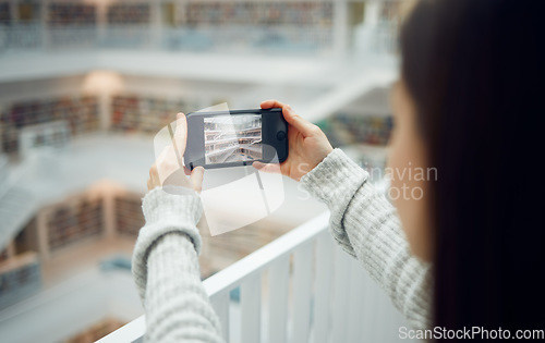 Image of Library, student and woman taking pictures with phone for social media. Education scholarship, tech and female taking photo with mobile smartphone for online profile or college memory in university.