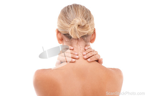 Image of Neck pain, injury and woman in a studio with discomfort, stress or ache after a spa body care treatment. Self care, sore and back view of a female model with a muscle sprain by a white background.