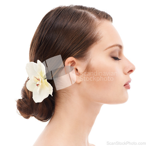 Image of Woman face, profile or beauty skincare and orchid flower, makeup cosmetics or dermatology healthcare wellness. Zoom, model or facial glow with plant, healthy collagen or hairstyle on white background
