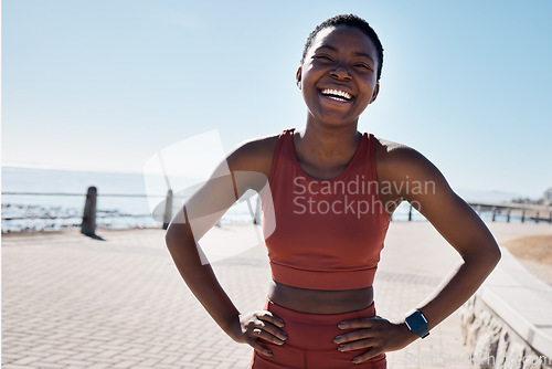 Image of Fitness, black woman and portrait of a runner by the sea with happiness and smile training. Relax, happy and workout of a athlete doing sport, marathon and exercise ready for cardio running