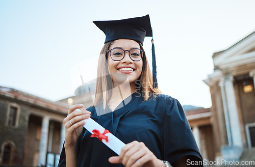 Image of Portrait, graduate and study with a student woman holding a diploma or certificate outdoor on graduation day. Education, goal or unviersity with a female pupil outside after scholarship success