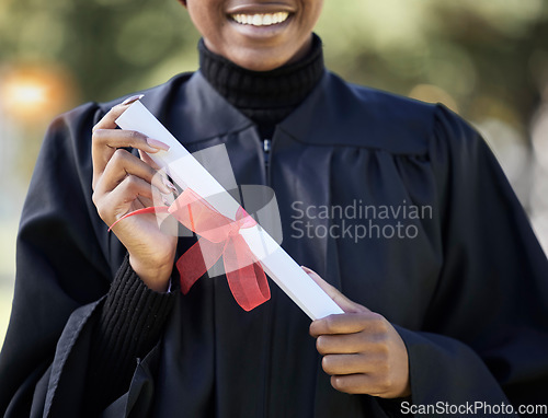 Image of University graduation, diploma and hands of black woman with award for studying achievement. Closeup graduate student with paper certificate of success, celebration and education goals of learning