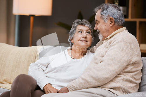 Image of Love, sofa and senior couple talking, marriage and bonding for relationship, retirement and romance. Romantic, elderly man and mature woman in living room, conversation and relax on weekend break.