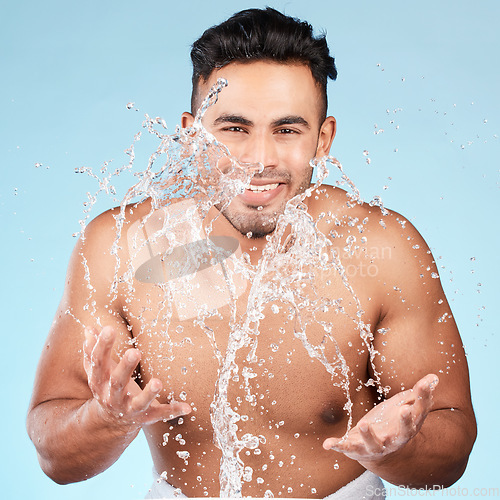 Image of Cleaning, water splash and portrait of man happy with self care routine, facial hygiene and body hygiene wash. Water drop, bathroom skincare hydration and beauty model with health wellness treatment