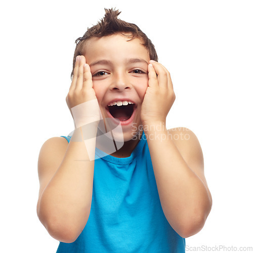 Image of Portrait of adorable little boy touching face in surprise, isolated on white background in studio with copyspace. Cute child standing alone with mouth open in shock. Wow and amazed facial expression