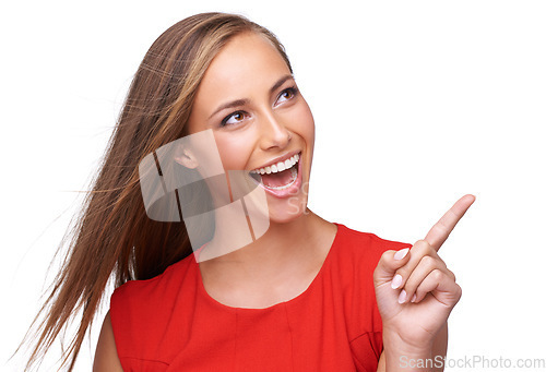 Image of White background, pointing finger and face of woman for fashion, marketing and advertising. Beauty, retail and girl model with copy space for deal, sale and product placement isolated in studio