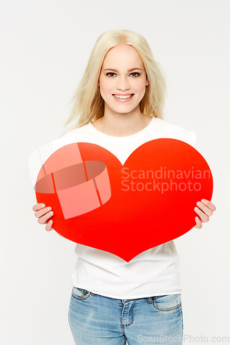 Image of Love, portrait and woman in studio with paper heart, sign and emoji against white background. Face, shape and girl showing care, affection and self love, happy and content, young and isolated space