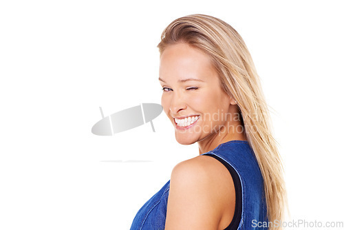 Image of Portrait, wink and mockup with a woman in studio on a white background for friendly flirting. Face, winking and smile with a happy young female posing to promote space for marketing or advertising