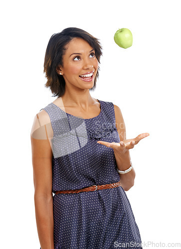 Image of Throw, health or black woman eating an apple or fruits in studio on white background with marketing space. Smile, organic or happy African girl advertising healthy food diet for self care or wellness