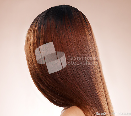 Image of Salon, hair and back of woman in studio for hair care, hair products and cosmetics on beige background. Beauty, balayage and girl with healthy, shine and long hair for hair salon, treatment and glow