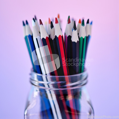 Image of Creativity, art and drawing pencil container for school coloring stationery zoom. Closeup of a glass jar with color pencils in purple gradient studio background for creative education.
