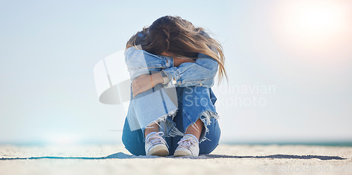 Image of Sad woman, stress or depression by beach, sea environment or nature ocean with bipolar, loneliness or burnout. Mental health, anxiety or confused person crying with doubt, crisis fail or bad problem