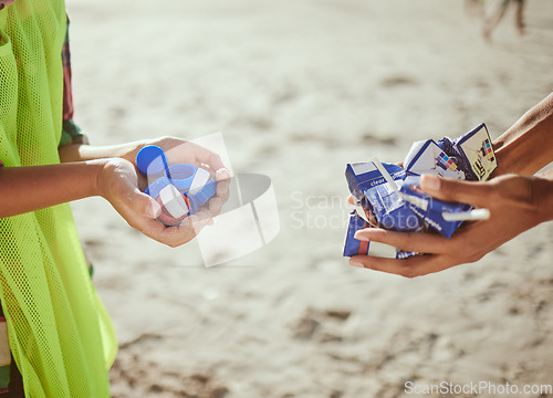 Image of Cleaning, plastic and hands of volunteer at beach for recycle, environment or earth day. Recycling, sustainability and climate change with charity team and trash for pollution, eco friendly and help