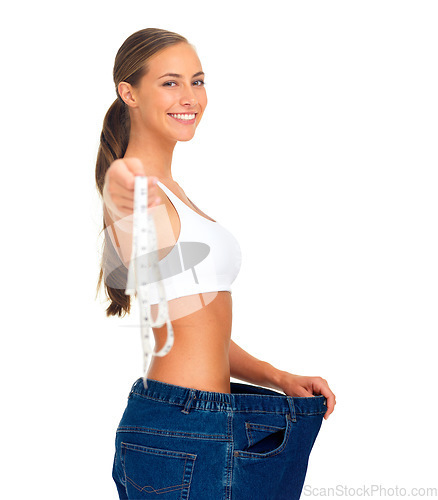 Image of Diet, weightloss and happy woman with measuring tape, jeans and smile isolated on white background. Fitness, healthcare and wellness, woman with slim figure and liposuction skinny waist measurement.