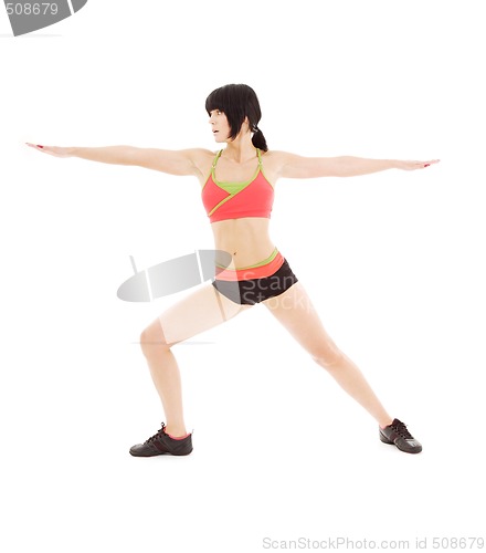 Image of woman practicing virabhadrasana warrior pose