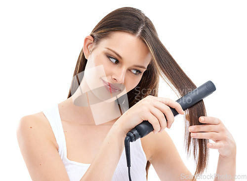 Image of Woman, hair with hair straightener and beauty with hair care, electric cosmetic tools against studio background. Straight hair, keratin and treatment with hairstyle, shine with wellness and grooming