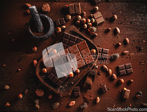 Image of Cocoa powder, beans and chocolate bar pieces