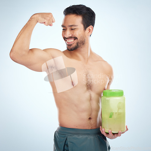 Image of Fitness, man and protein powder for muscle gain, diet and weight loss on grey studio background. Male, athlete and body builder for sports nutrition container, supplement and healthy energy drink.