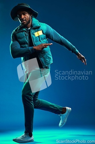 Image of Fashion, neon and portrait of black man on blue background with cool, trendy and stylish outfit. Creative style, urban clothing and male fashion model in studio with designer, modern and edgy clothes