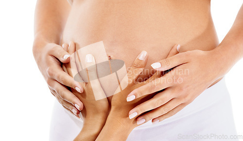Image of Hands, pregnant and mother with a woman in studio on a white background expecting a beautiful baby. Family, love and pregnancy with a female touching the belly of an expectant mom or parent