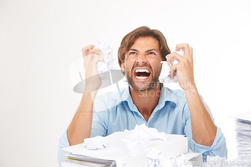 Image of Angry, stress and burnout in businessman with crumpled paper for brainstorming, thinking of bad ideas and strategy. Deadline, chaos and frustrated worker with mess of documents, paperwork and notes