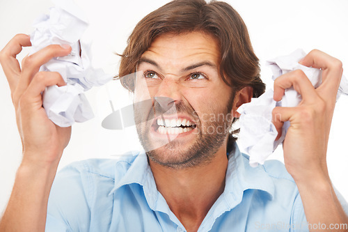 Image of Angry, business man and burnout with tax documents and frustrated worker with white background. Isolated, overworked and anger about mistake with audit paperwork and mental health problem from work