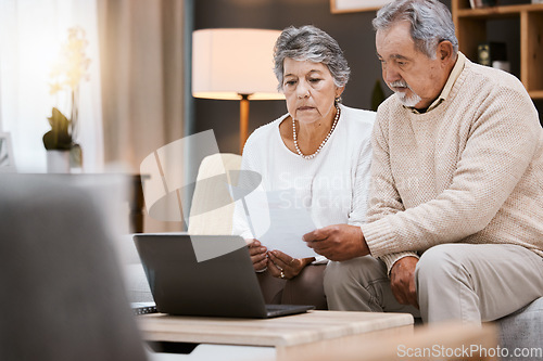 Image of Laptop, documents and retirement with a senior couple planning their savings or investment portfolio. Budget, finance and pension with a mature man and woman working on a computer together in a home