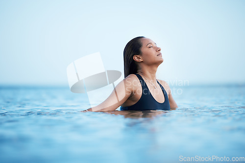 Image of Sea, swimming and relax with a woman in nature, outdoor on holiday or vacation enjoying a swim in the ocean with mockup. Water, summer and freedom with a female swimmer outside for travel or tourism